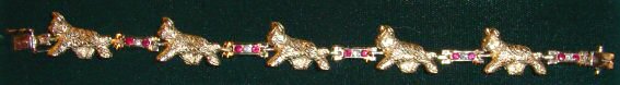14K Gold Samoyed Bracelet with Musher and Sled and 8 Point Channel Set Diamonds and Sapphires